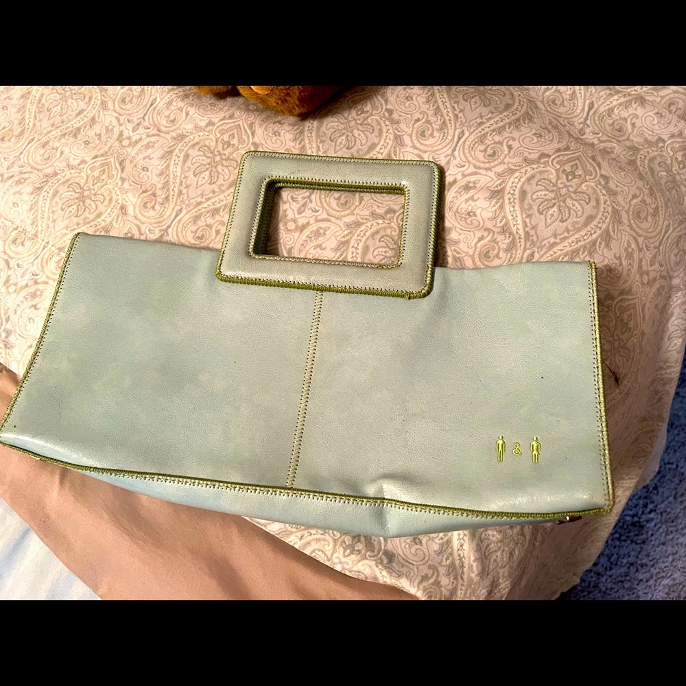 Light blue clutch with hot pink interior